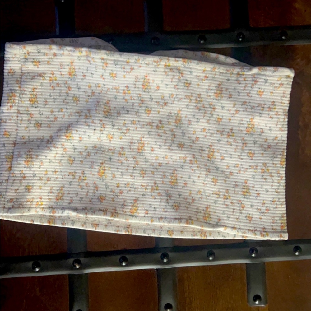 a strapless croc top with cute flowers and is good for the summer or spring